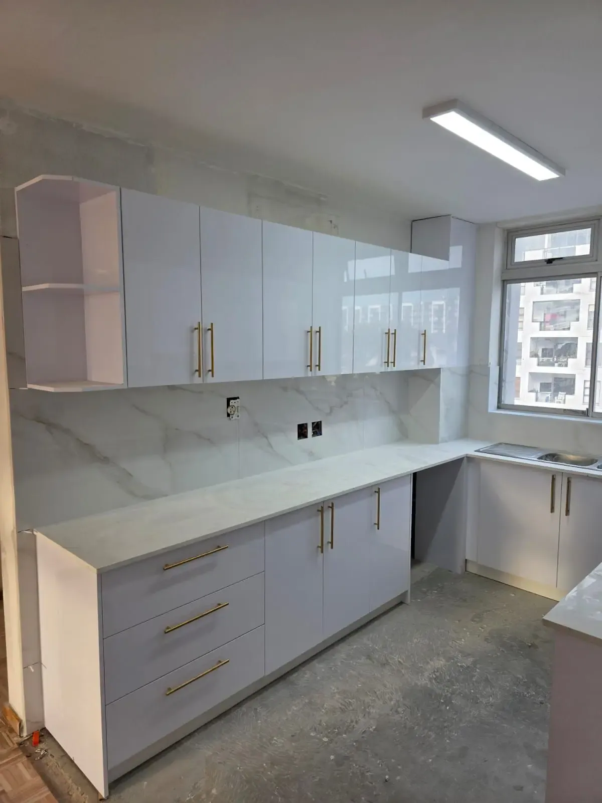 The same Ground Seed Designs kitchen after: custom-built cabinetry